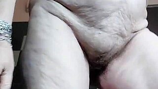 Grandma stuffs hairy pussy with cucumber in homemade fun
