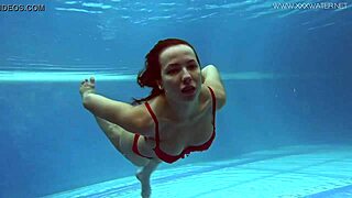 watch lina mercury in red lingerie underwater showing her big tits and tight pussy in the pool