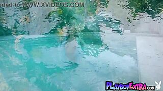 Ebony bombshell Julie Kay strips naked by the pool, shaking her big tits and pussy in erotic sunbathing