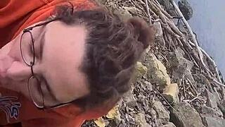 Brunette gives blowjob and photoshoot by the river outdoors