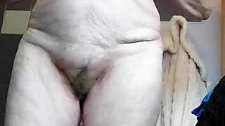 Grandma stuffs hairy pussy with cucumber in homemade fun