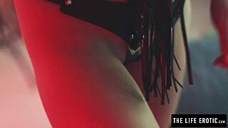 Pretty redhead in corset and stockings whips own ass fingering to orgasm