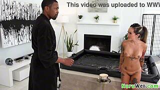 Asian petite masseuse with tattoos gives nuru massage to black client