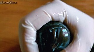 i love how i jerk off this big black dildo wearing my gloves carefully