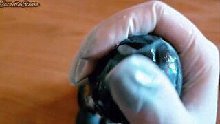 i love how i jerk off this big black dildo wearing my gloves carefully