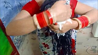 she takes a relaxing shower in her wetlook saree, letting the water soak through the fabric completely