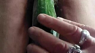 Feeling excited as German granny masturbates hairy pussy solo with cucumber