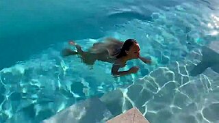 Gorgeous monika fox strips for naked swim in outdoor pool. Pierced nipples shine on big fake tits in public.