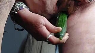 Feeling excited as German granny masturbates hairy pussy solo with cucumber
