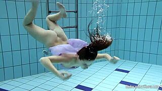 aneta shows off big tits in purple dress during pool time fun