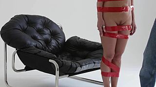 Blonde Playboy Girl Tied Up with Red Tape in Bondage Behind the Scenes!