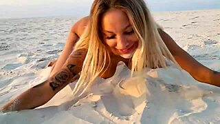 Naked Monika Fox Poses On Beach With Sand But Reveals Shaved Pussy And Pierced Nipples Outdoors