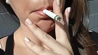 KELLY KENDRICKS SMOKES CIGARETTES OUTDOORS WITH BIG TITS CLEAVAGE ON DISPLAY!