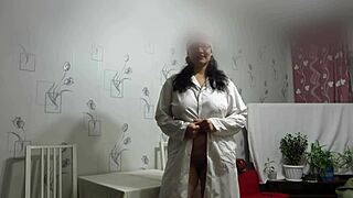 Doctor fists and masturbates mature nurse's shaved pussy