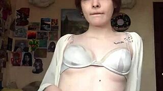 She boldly removes her underwear on camera to reveal a smooth shaved pussy for intense masturbation.