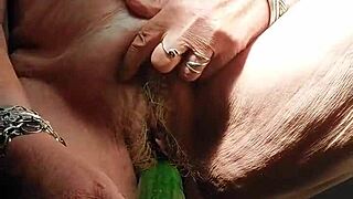 i can't get enough of granny's hairy pussy fucked by that huge cucumber