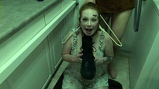 Enthusiastic redhead degradation slut submits to domination by licking messy cum from boot