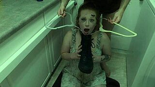 Enthusiastic redhead degradation slut submits to domination by licking messy cum from boot