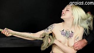 Giantess towers over two bound girls whipping and caning in fierce bdsm fight