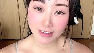 a naughty japanese girl bares her huge natural tits for you