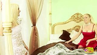 two lingerie-clad lesbians moan wet pussies with dildos