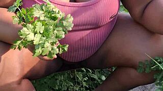 curvy ebony beauty tends church garden with big assets