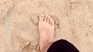 Bare feet sink into sand exploring every sensory texture and feel step by step