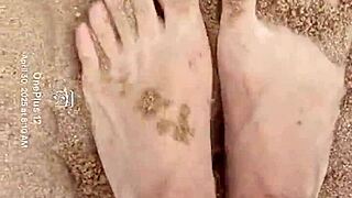 Bare feet sink into sand exploring every sensory texture and feel step by step