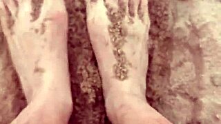 Bare feet sink into sand exploring every sensory texture and feel step by step