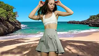 curvy teen in miniskirt dances braless on beach until wind reveals wet panty-less pussy