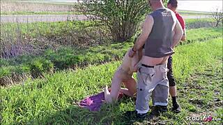 Two young guys fuck german nudist granny on beach