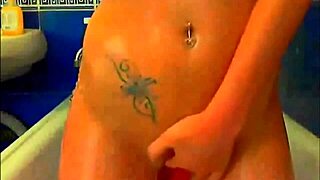 tattooed model fingers pussy and rides glass dildo in bathroom webcam show