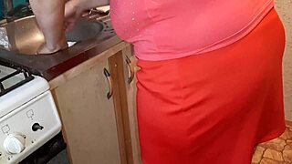 She bends over the kitchen counter while I stroke watching her cook