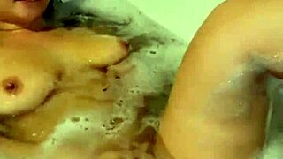 Asian babe masturbates juicy pussy in relaxing bath vibrator play
