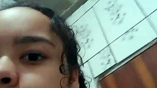 horny young latina teases wet pussy under steamy shower for fun