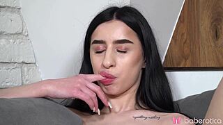 Elizamars fingers shaved pussy and orgasms with toy on sofa naked