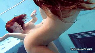 Katrin And Lucy's Big Tits Bounce Underwater At Beach Pool