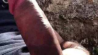 Jerking huge load outdoors in voyeur thrill