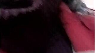 french slave bound in leather harness exhibits during outdoor autoseance