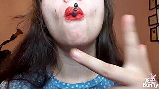 big red lips brunette smokes while teasing curvy tits pov closeup