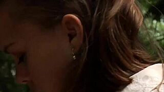 Lesbian mistress gropes bound slave's big tits in domination play