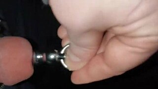 Jayq stretches urethra with 14mm steel sounding and 13mm plug