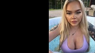 gringa flaunts her massive tits by the pool
