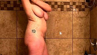 Hey, Watch This Sexy Tattooed Milf Squirt Fingering Ass In Shower!