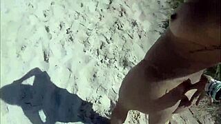 saw this african babe with big tits getting naughty on the beach edge...