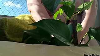 Naked Amateur Flashes Big Natural Tits Watering Plants On Balcony