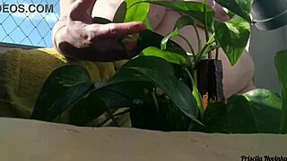Naked Amateur Flashes Big Natural Tits Watering Plants On Balcony