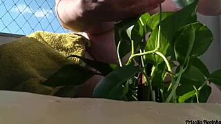 Naked Amateur Flashes Big Natural Tits Watering Plants On Balcony