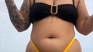 yellow bikini splits my swollen pussy on beach...