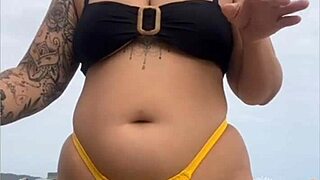 yellow bikini splits my swollen pussy on beach...
